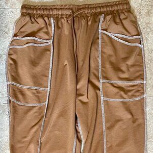 Brown knit pants with elastic waist.